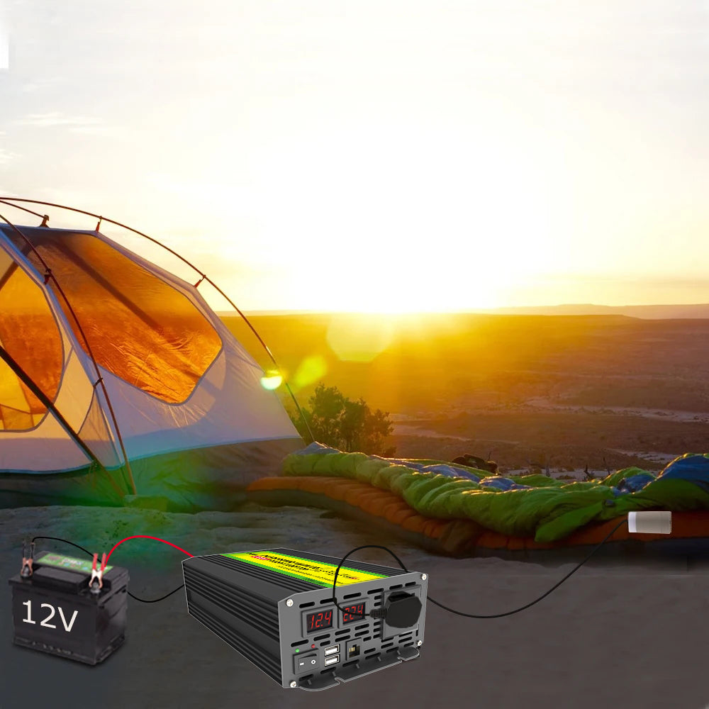 Camping scene with a tent, battery, and power inverter at sunset.